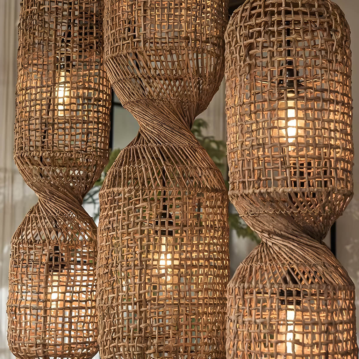 Hand-woven rattan & iron pendant light, sculptural twist