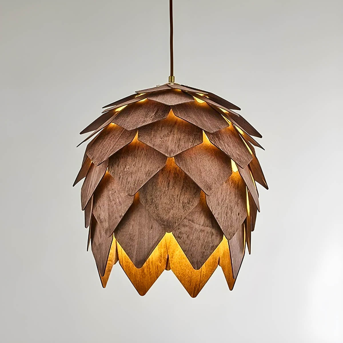Layered natural wood pendant light, pine-cone silhouette