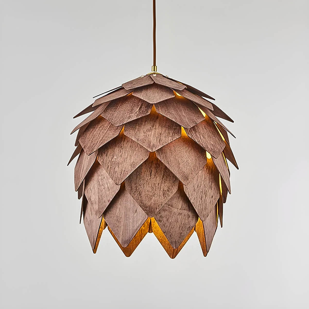 Layered natural wood pendant light, pine-cone silhouette