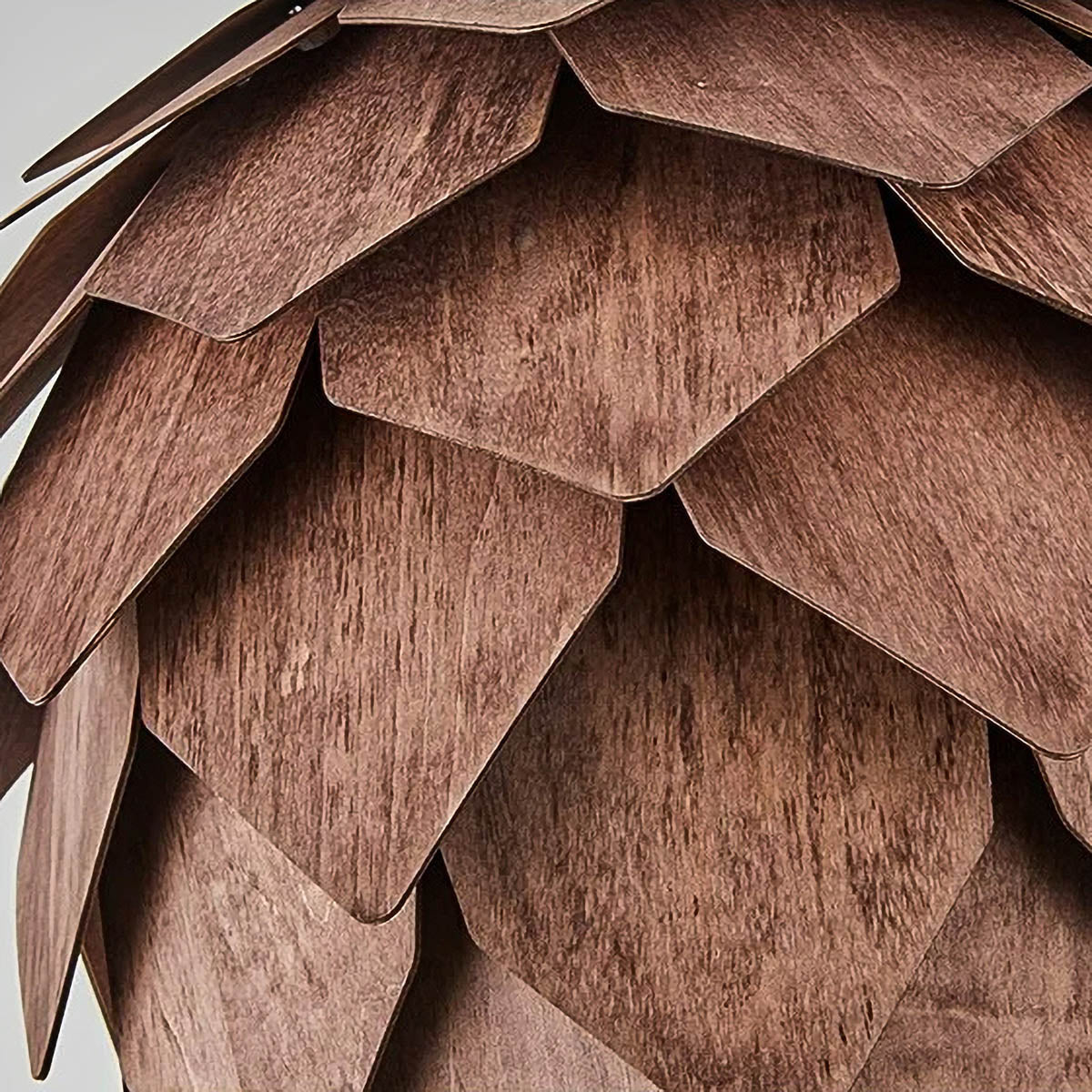 Layered natural wood pendant light, pine-cone silhouette