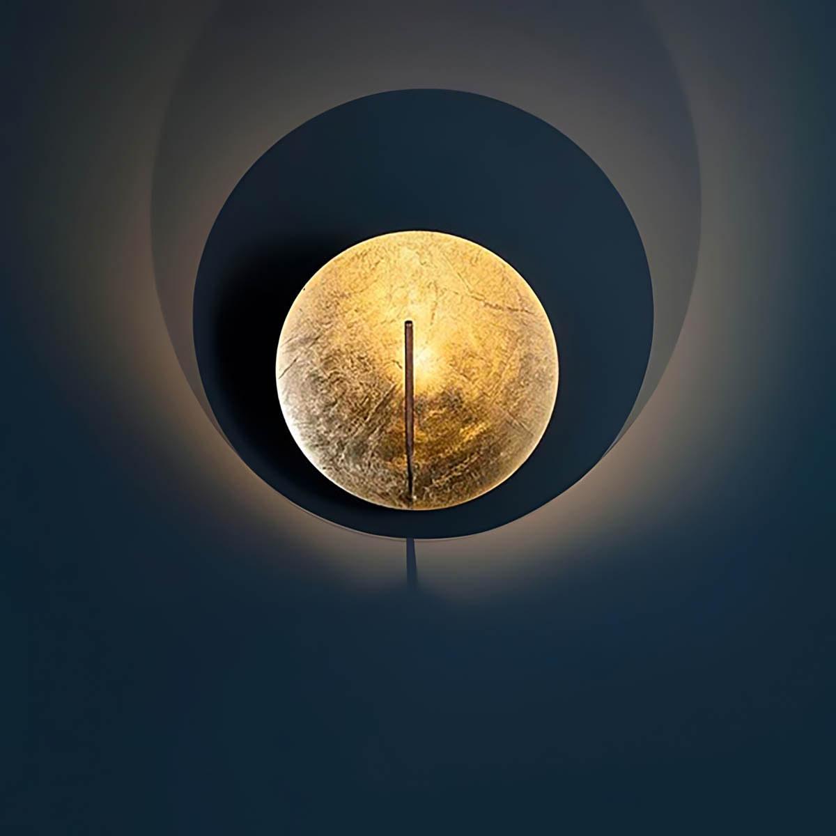 VITRUVIUS gold foil metal wall light with artistic cutouts